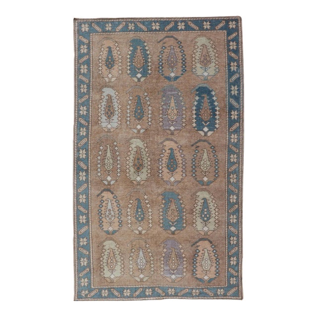 Vintage Turkish Tulu Rug With Large Scale Paisley Design in Tans, Brown and Blue 3'5"x6'1" For Sale