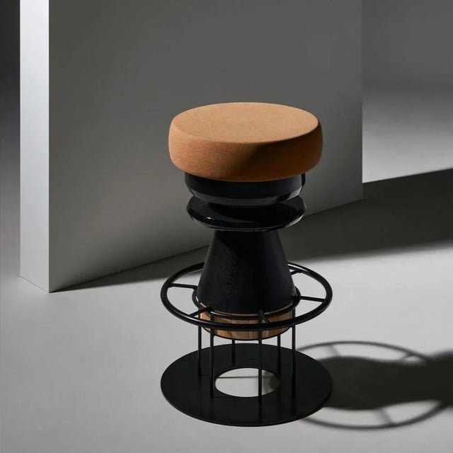 Set of 2 medium black tembo stool, note design studio dimensions: d 36 x h 64 cm materials: lacquered steel structure,...
