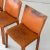 c. 1980s. Price is for the set. Contact us if you’d like to purchase a single item. Brown leather cab chairs with arms....