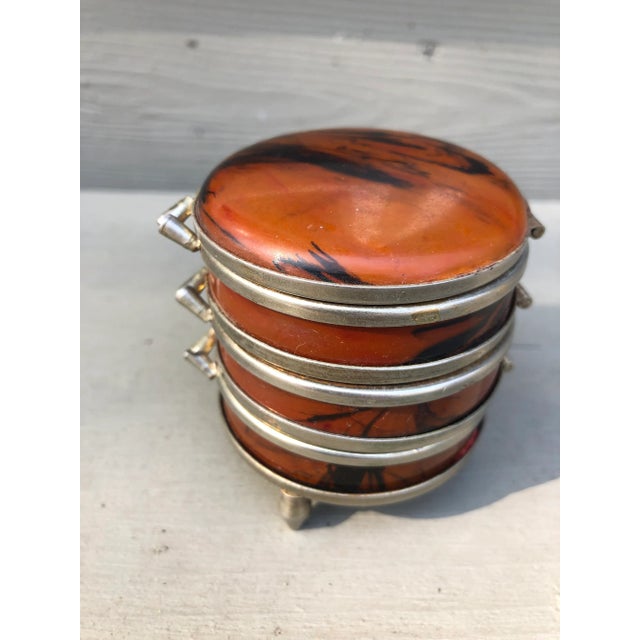 A diminutive faux marble jewelry or trinket box, probably dating from the 49’s-50’s, divided into three hinged...