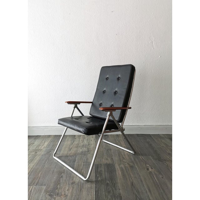This folding, luxurious mid-century chair dates from the 1960s and is designed in a minimalist Scandinavian style. The...