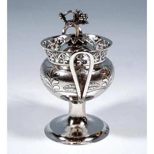 Empire silver sugar vase, pressed bulbous body on a high, offset round stand with a fluted rim, the upper half of the...