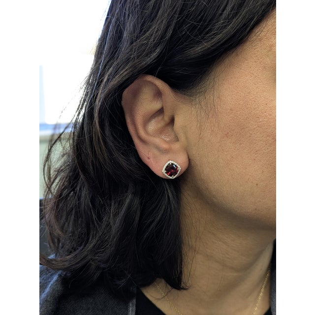 These 4.5ct garnet studs steal the spotlight with an elegant natural diamond halo in 14k white gold. A striking 8mm duo...