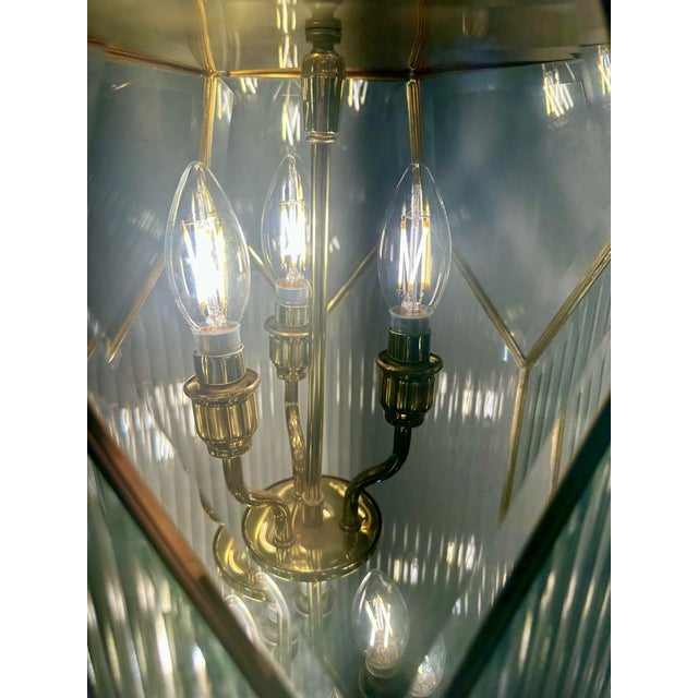 Grand-scale new old stock hexagonal 9-light Art Deco Revival chandelier with fluted-glass panels. This beauty looks like a...