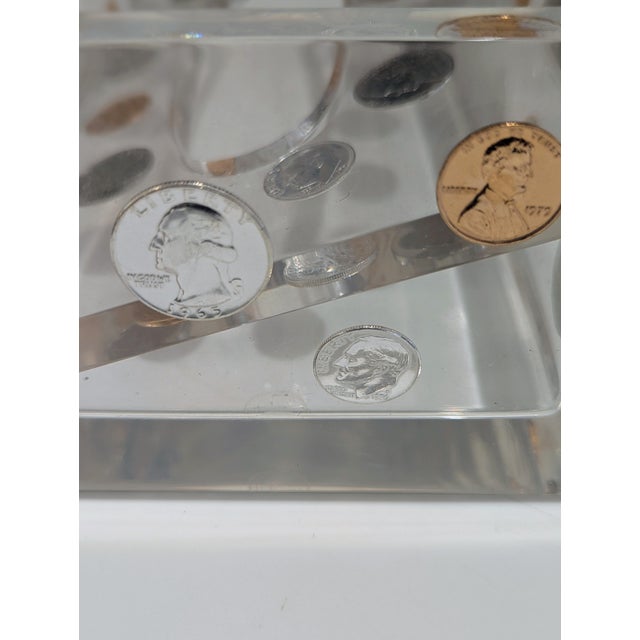Clear cast Lucite tissue box holder featuring encapsulated U.S. coins suspended within the acrylic walls. Rectangular low-...
