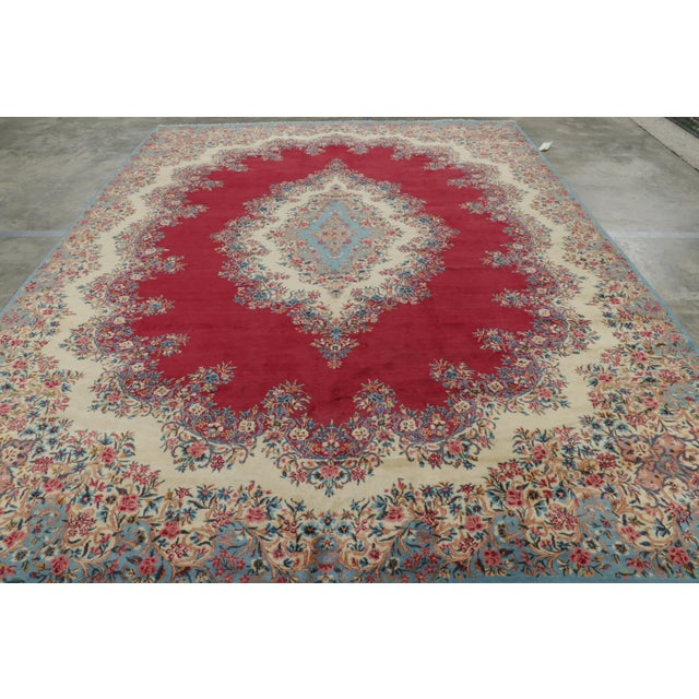 Made with hand-knotted wool circa 1930-1940, this 10x14 vintage Persian rug originating from Persia, hails from one of the...