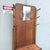 A handsome antique hall tree crafted in richly figured tiger oak, showcasing dramatic grain throughout its tall...