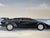 Black 1980s Schamerhorn Black Lamborghini Countach on Sandy Beach Oil on Canvas Painting – Signed, Unframed For Sale - Image 8 of 14