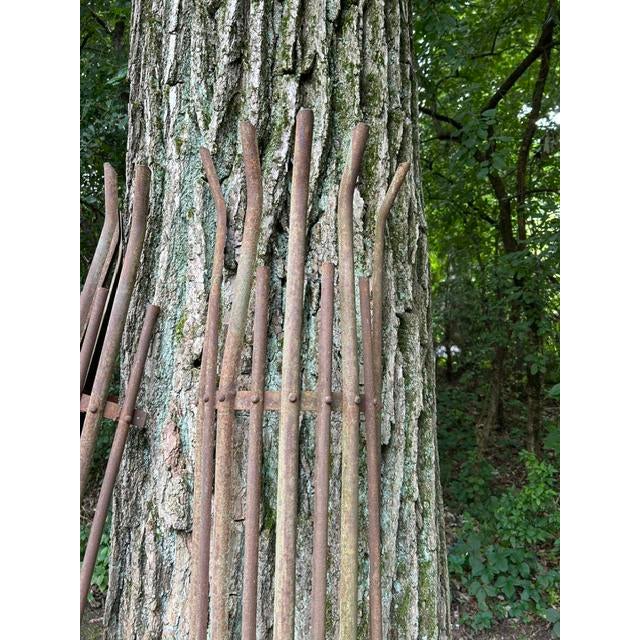 A handsome pair of antique wrought iron tree guards from an English-style or French estate garden, dating to the early...