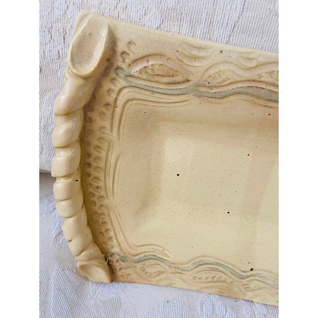 A truly beautiful work of art signed Williams, this footed rectangular bread platter has twisted handles that resemble...
