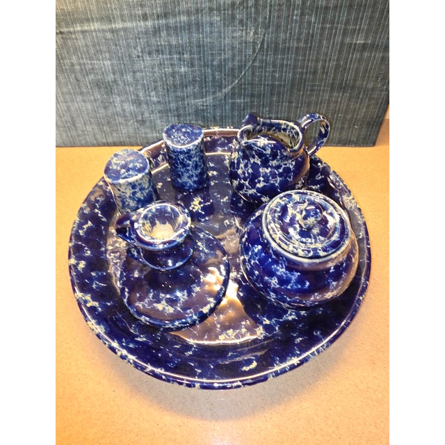 Nice collection of vintage Bennington Pottery items. Large round tray, set of salt and pepper shakers, candle holder and...