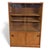 The Danish sliding glass bookcase is a mid century teak veneer cabinet designed to combine style and function, offering a...