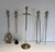 These beautiful neoclassical-style fireplace tools are made of brass. They are topped with pine cones. This is a French...