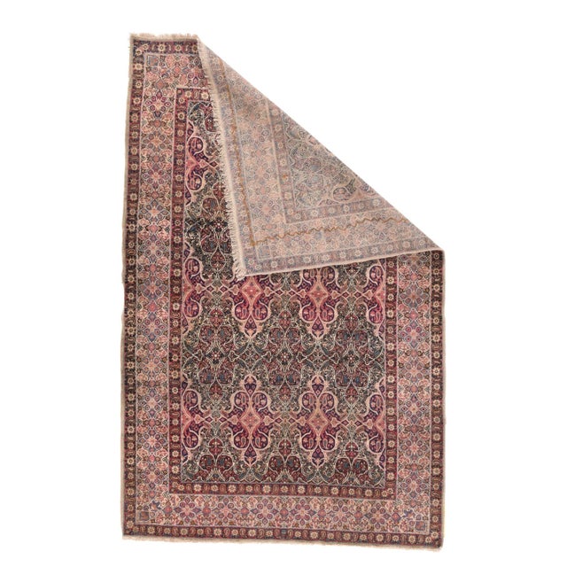 This finely woven city scatter has a cream field closely covered by an ivory arabesque pattern creating curvaceous navy or...