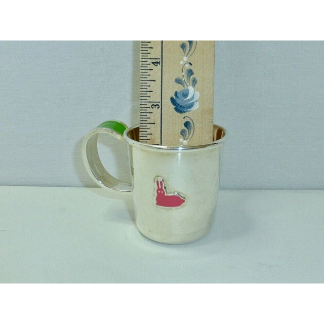 The perfect baby gift, this rare and discontinued silver plate and enamel baby feeding set was designed by the late style...