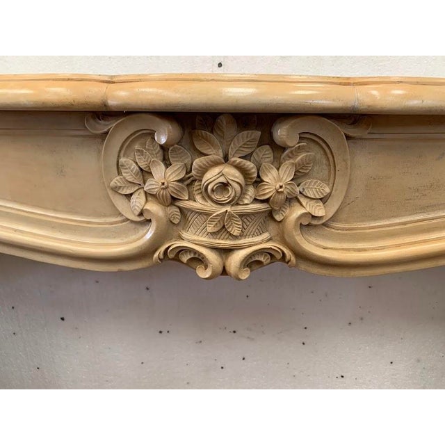 Louis xv style natural stone fireplace two fluted, curved jambs arched frieze decorated with a relief sculpture very high-...