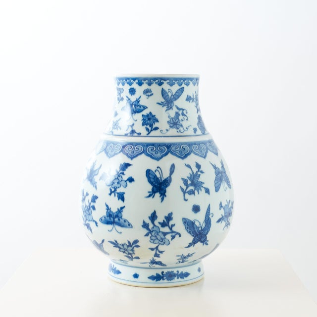 Blue and White Globular Vase with Butterflies and Floral Motifs China, 20th Century Qianlong style porcelain globular vase...