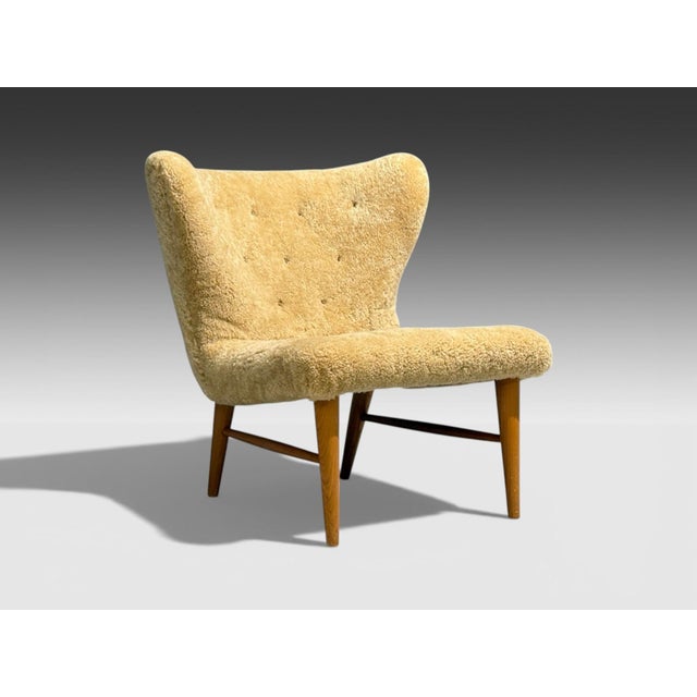 Erik Bertil Karlén, Swedish Mid-Century Modern, Easy Chair, Beech, Sheepskin, Sweden, 1940s A gorgeous easy chair designed...