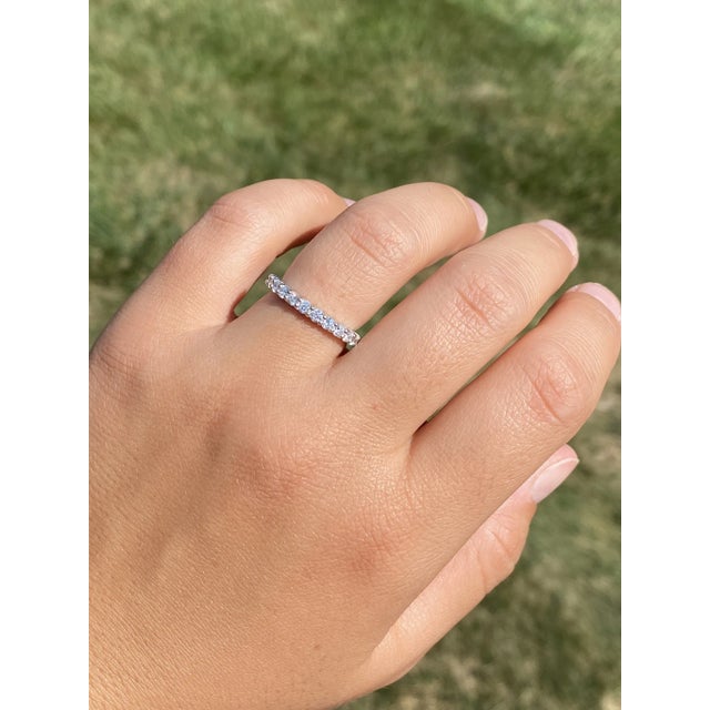 The Belarose: Ladies 14K White Gold Shared Prong Diamond Wedding Band. Crafted in 14 karat white gold, this ladies band...