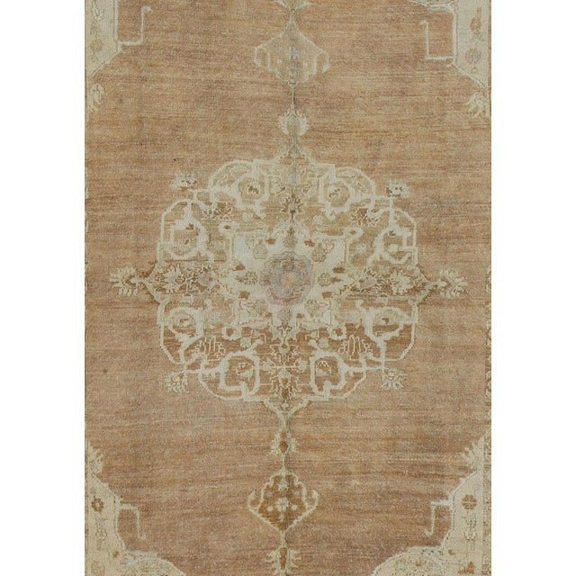 Measures: 7'0'' x 12'5''. This vintage Turkish carpet, (circa mid-20th century) features an elegant central medallion...