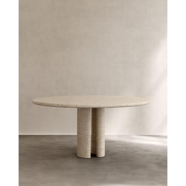 Roman dining table iii in roman travertine by paloma editions dimensions: d 160 x w 160 x h 75 cm. Materials: travertine....
