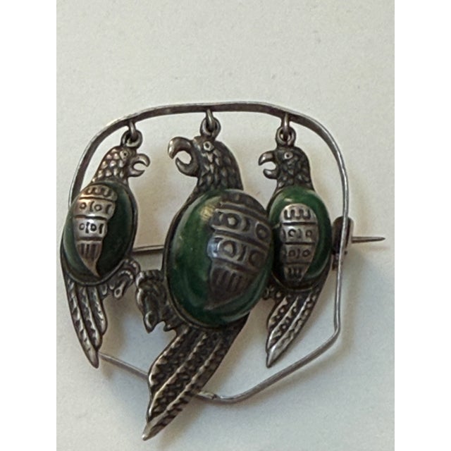 Beautiful vintage Mexican sterling silver three-parrot brooch. Handcrafted between the 1940s and 1960s, this iconic design...