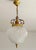 Stunning Hollywood Regency style pendant light, circa 1980, known as the "pineapple" pendant, featuring a beautiful molded...