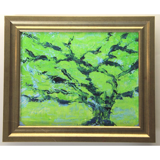 An oil painting of an abstract tree boldly painted in a traditional Japanesque or Chinoiserie style in indigo blue and...