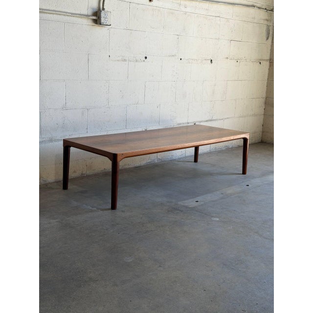 This beautiful large vintage Danish rosewood coffee table is a striking example of Mid Century Modern Scandinavian design,...