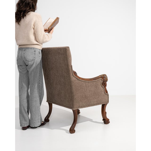 An elegant Empire period armchair defined by its refined symmetry and classical inspiration. Crafted in the early 19th...