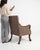 An elegant Empire period armchair defined by its refined symmetry and classical inspiration. Crafted in the early 19th...