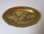 This unusual decorative platter has a gold leaf boarder with scroll designs and a scalloped edge. The center is decorated...