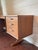 A mid century modern teak vanity dressing table, circa 1960s. Made by the renowned British furniture maker, Austinsuite,...
