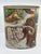 1987 vintage metal wastebasket that is double sided with dinosaurs on one side and mammoths/ sabertooth Tiger on the other...