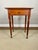 A mid-19th century cherry side table with turned legs and distinctive compressed bun feet. Solid cherry construction...