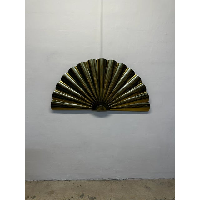 Large brass wall sculpture in the form of a fan or shell by C. Jere Artisan House. Signed and dates 1989.