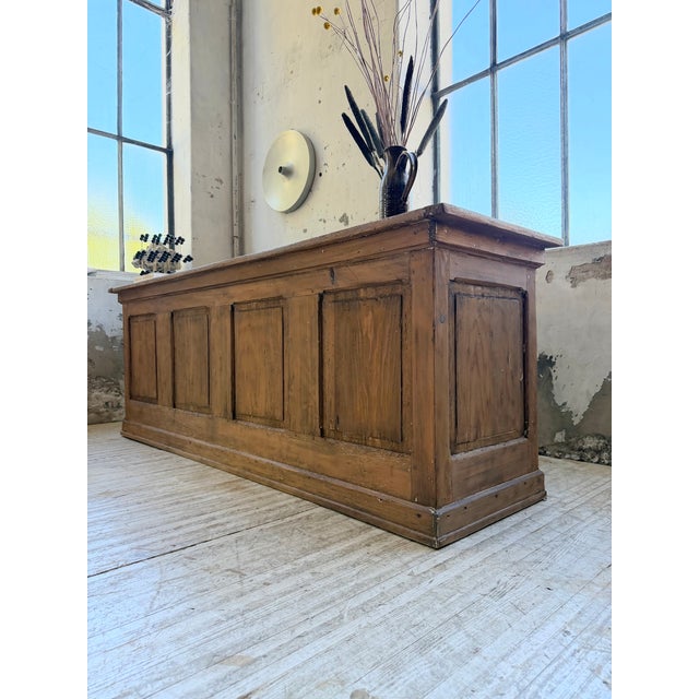 Vintage 1950s pine shop counter. We love its simple lines, paneled fronts, and large mortise and tenon top. at the back,...