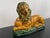 1950s Enesco majolica, ochre yellow and green, resting lion with ball under paw. A great decorative item of majolica in...
