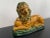 1950s Enesco majolica, ochre yellow and green, resting lion with ball under paw. A great decorative item of majolica in...