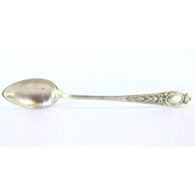 Silver Rice and Serving Spoon with Floral Reliefs Handle and Monogram Card, in Very Good conditions. Designed 1890 to 1919...