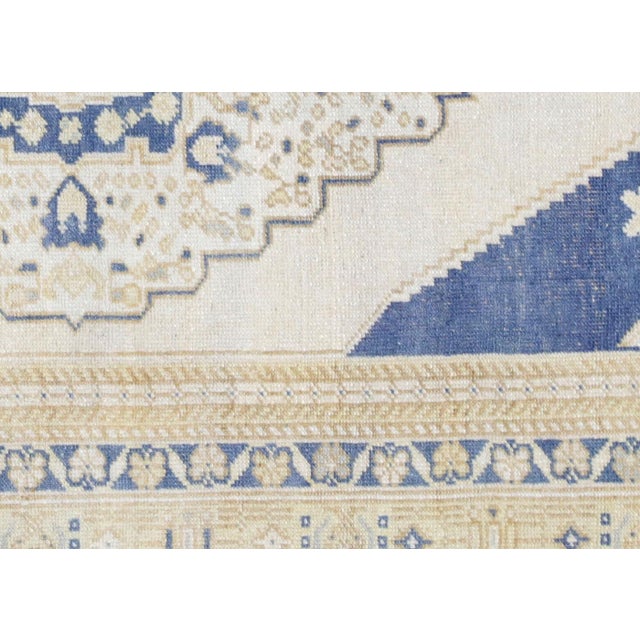 Handwoven in Turkey's Oushak region, this vintage wool rug measures 4' x 6'8" and features the bold geometric designs and...