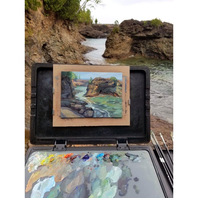 This oil painting captures the rugged beauty of Presque Isle, showcasing a dynamic interplay of vibrant colors in the rock...
