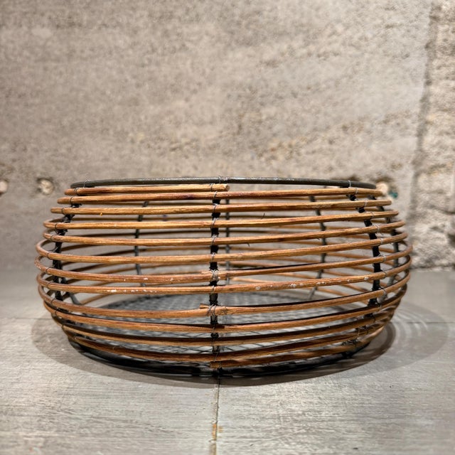 For your consideration, a round wicker and metal wrapped basket with a farmhouse rustic design. The basket features woven...