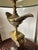 Elegant Frederick Cooper "Aladdin" table lamp featuring the iconic genie lamp motif mounted atop a classical column...