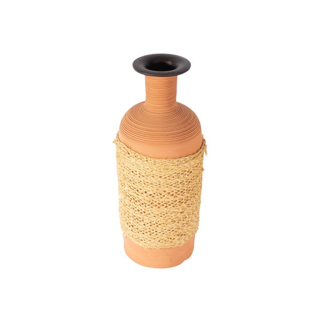 A ceramic vase produced for Raymor. Made in Italy, this terracotta vase features incised lines along the neck and top and...
