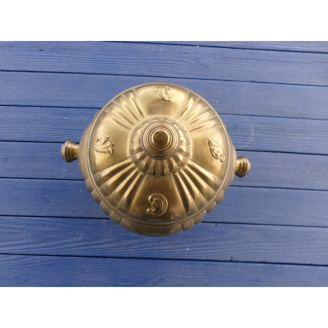 Beautiful large ribbed brass pot with lid, showcasing a rich, aged patina that adds warmth and character. This substantial...