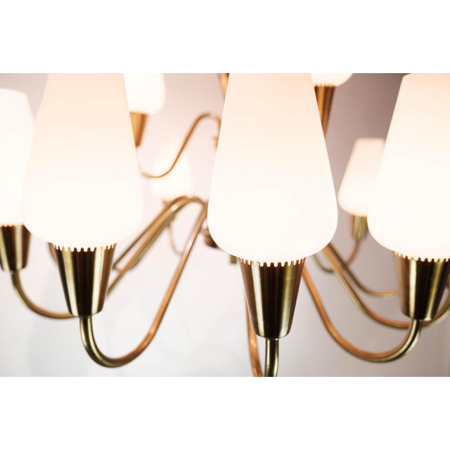 Lamp with arms of brass and glass, of Danish design from the 1950s. The lamp is in great vintage condition. European Plug...