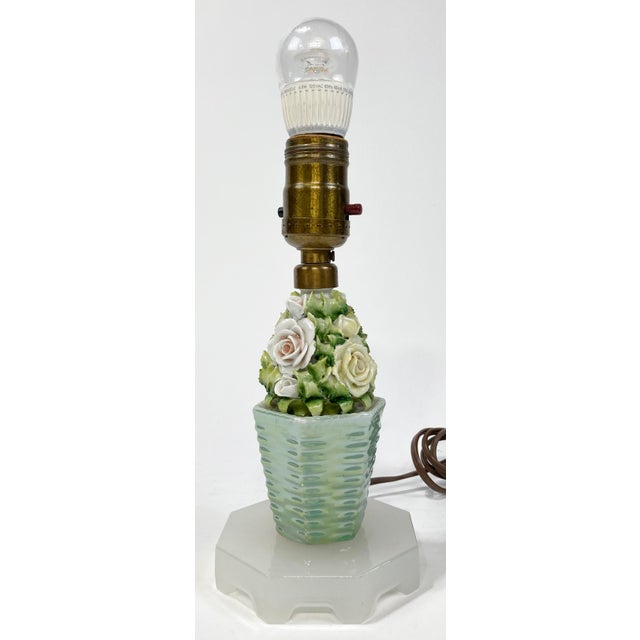 Perfect feminine vanity lamp with Capodimonte type porcelain roses to column. Sitting on opaque ivory stone base. Measures...