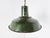 Vintage industrial pendant lights in dark green enamel. The lamps emit a soft light thanks to the white enamelled finish...