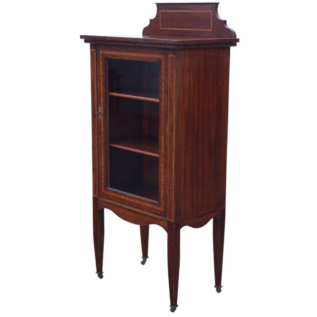An early 20th-century edwardian mahogany display cabinet with attractive age, colour, and patina. Full of authentic charm...